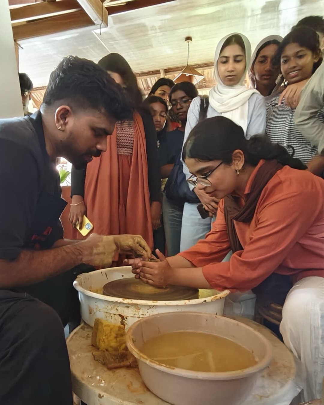 Beyond the Studio: Art, Craft & Culture at KACV
Semester 3 students of CAT visited Kerala Arts and Crafts Village (KACV) as part of an experiential learning initiative to explore Kerala’s rich artistic, craft, cultural, and architectural heritage.
The visit featured hands-on workshops in terracotta and dry flower making, enabling students to engage directly with traditional craft practices, explore material properties, and understand the creative processes behind handcrafted forms. These activities provided valuable opportunities to connect theoretical learning with practical experience while appreciating the skills, techniques, and cultural significance embedded in traditional crafts.
The experience enriched students’ understanding of material-based design and highlighted the relevance of traditional craft practices in contemporary design education.
#CollegeOfArchitectureTrivandrum #CATTrivandrum #KeralaArtsAndCraftsVillage #ExperientialLearning #ArtAndCraft CulturalHeritage DesignEducation